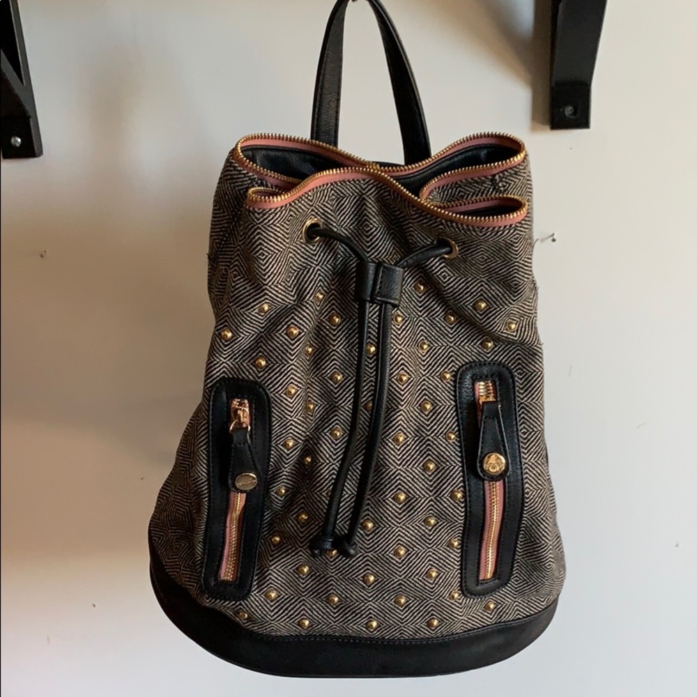 Leather and tweed fabric backpack